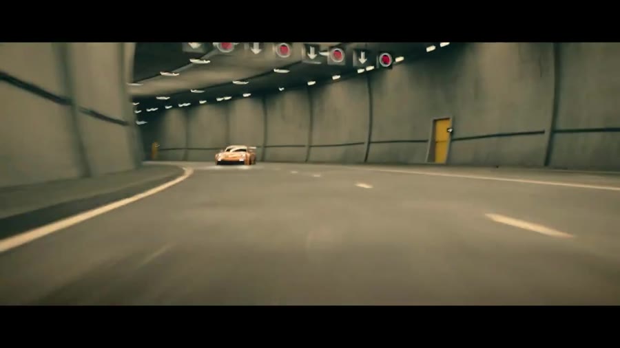 Car driving through an illuminated tunnel